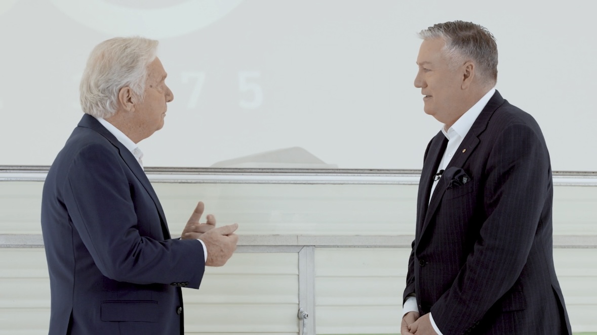 Two people in conversation in a documentary still